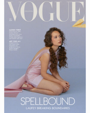 Vogue Philippines May 2026 cover with a woman in a pink dress kneeling against a blue backdrop and large 'SPELL BOUND' text across the bottom.